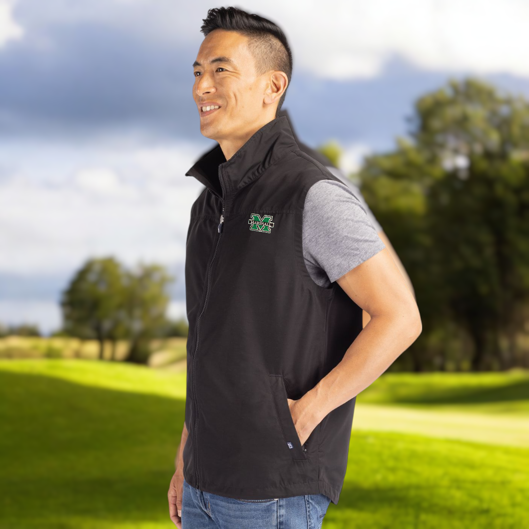 a model in the vest on a golf course