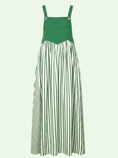A green and white striped midi dress with a solid green bib bodice and shoulder straps, shown against a pale mint green background.