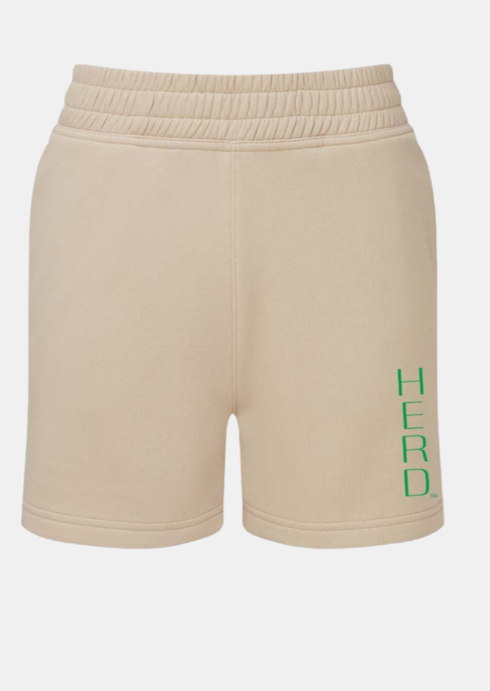 nude tone elastic waist shorts with HERD in block letters down the left leg