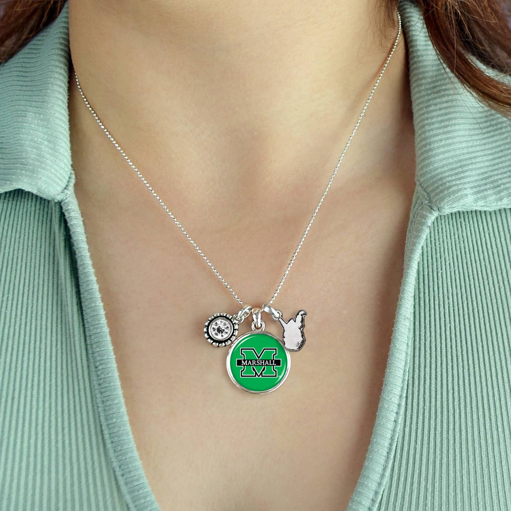 the necklace is shown on a model wearing a green vneck shirt