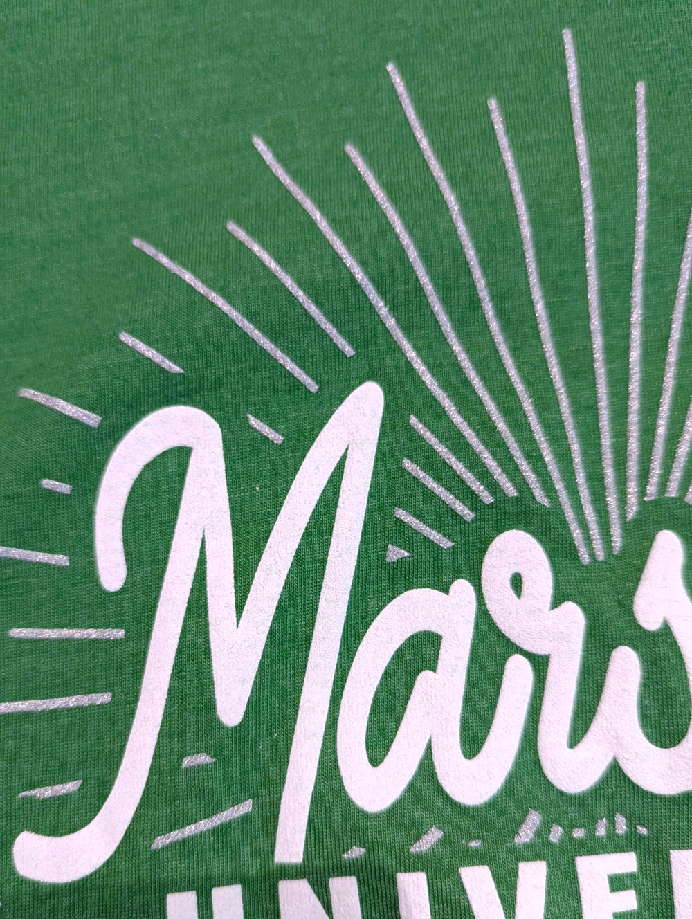 Close-up of a green fabric with white text and design