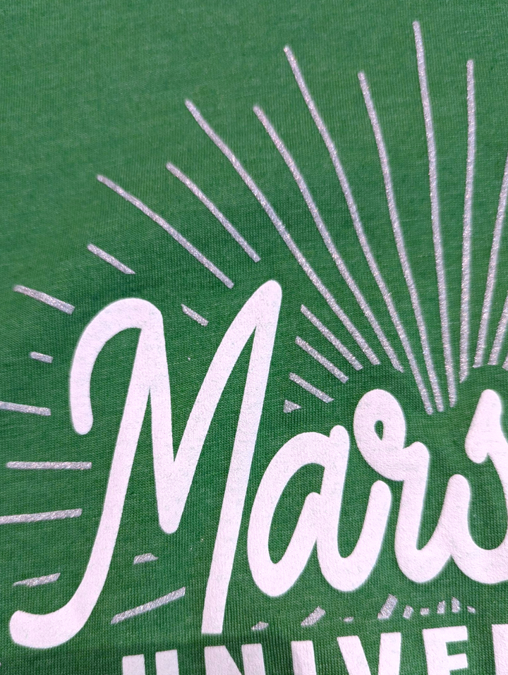 Close-up of a green fabric with white text and design