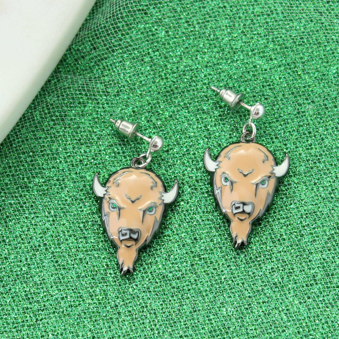 Bison head earrings on a green textured fabric background