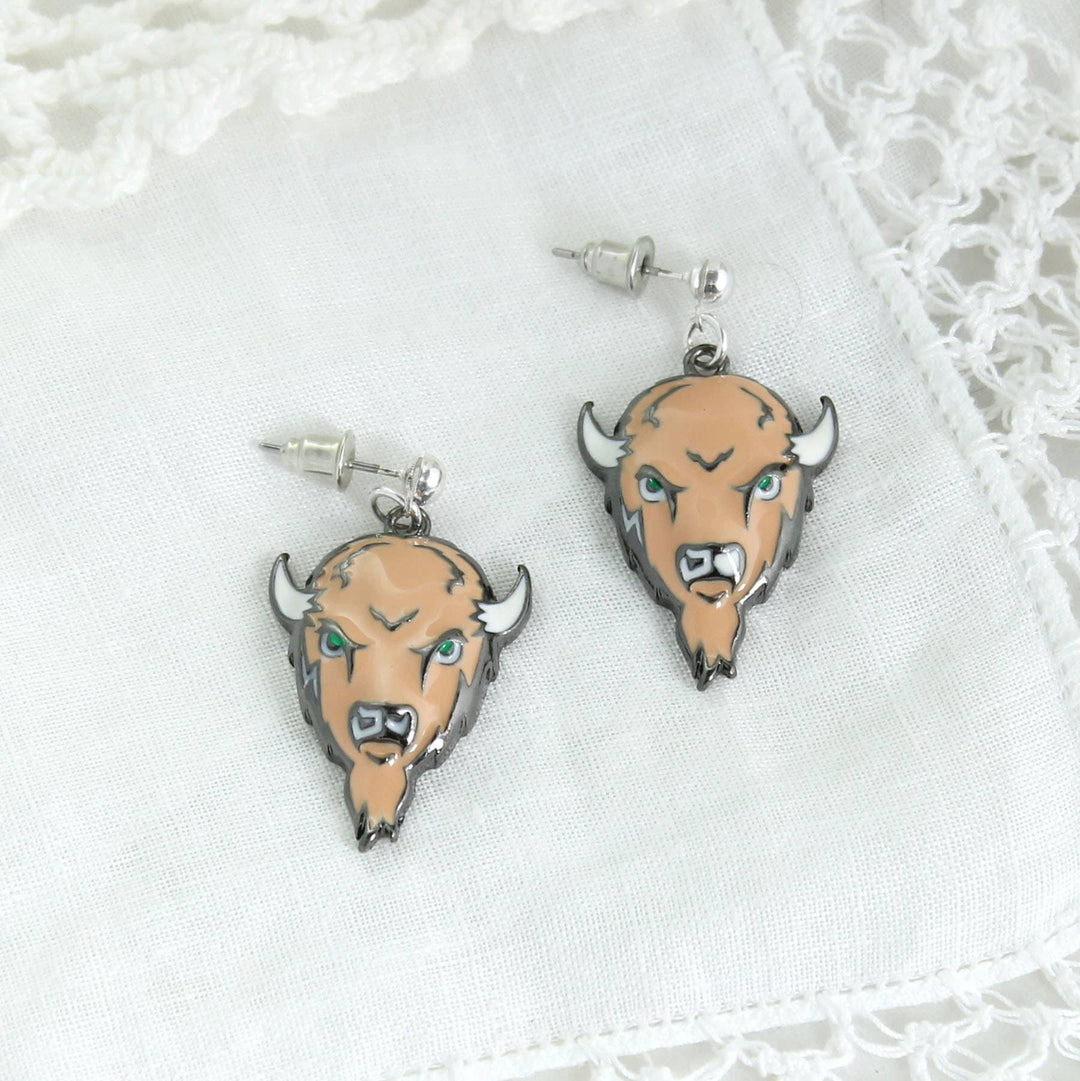Bison head earrings on a white lace background