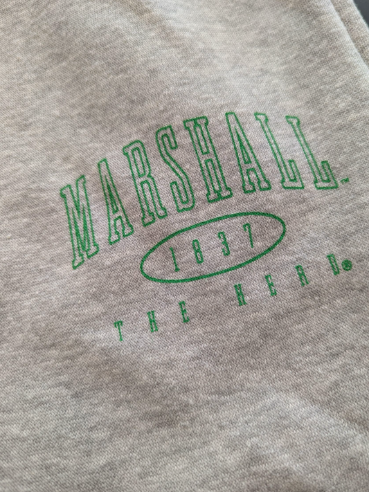 Gray sweatshirt with green 'Marshall 1837 The Herd' text on a close-up view