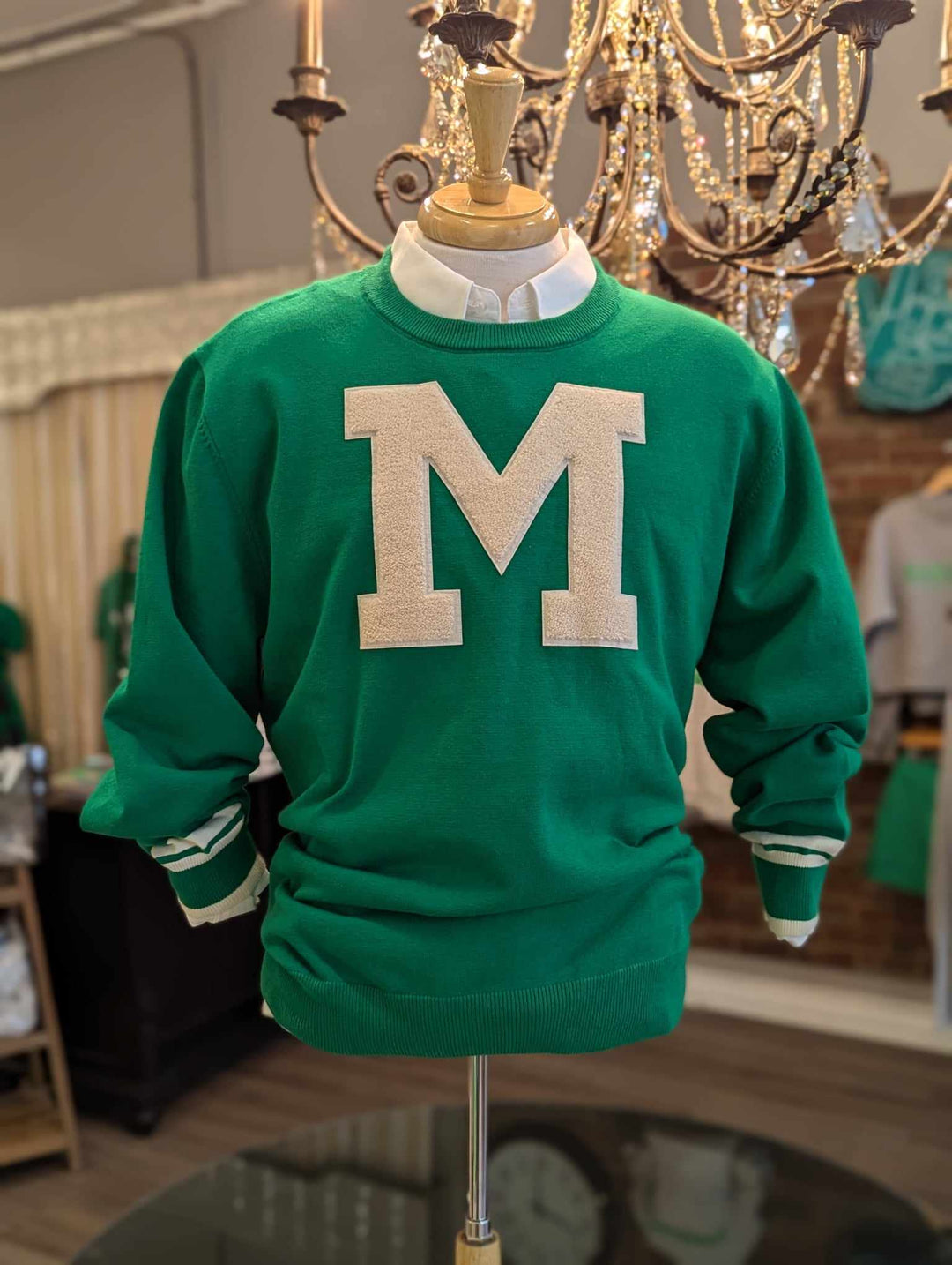 the mens cheer sweater on a mannequin