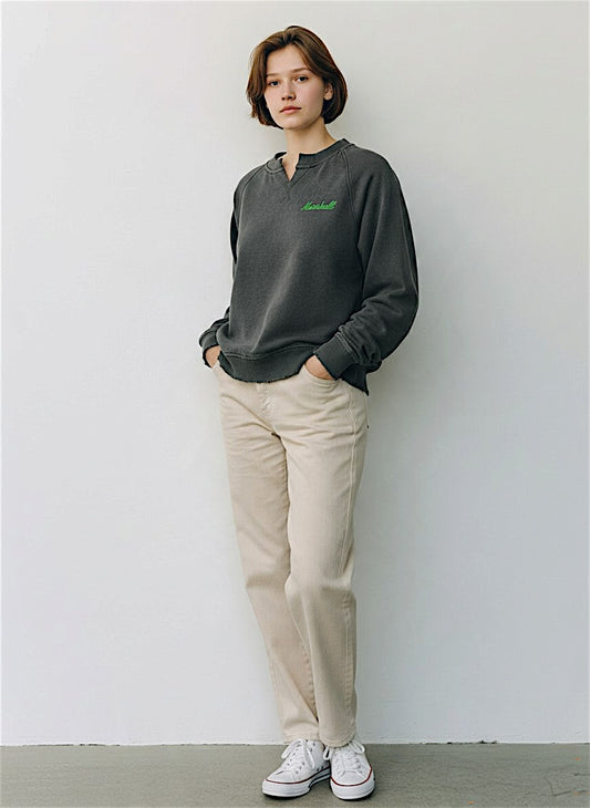 a model shows the willow washed crew paired with light trousers 