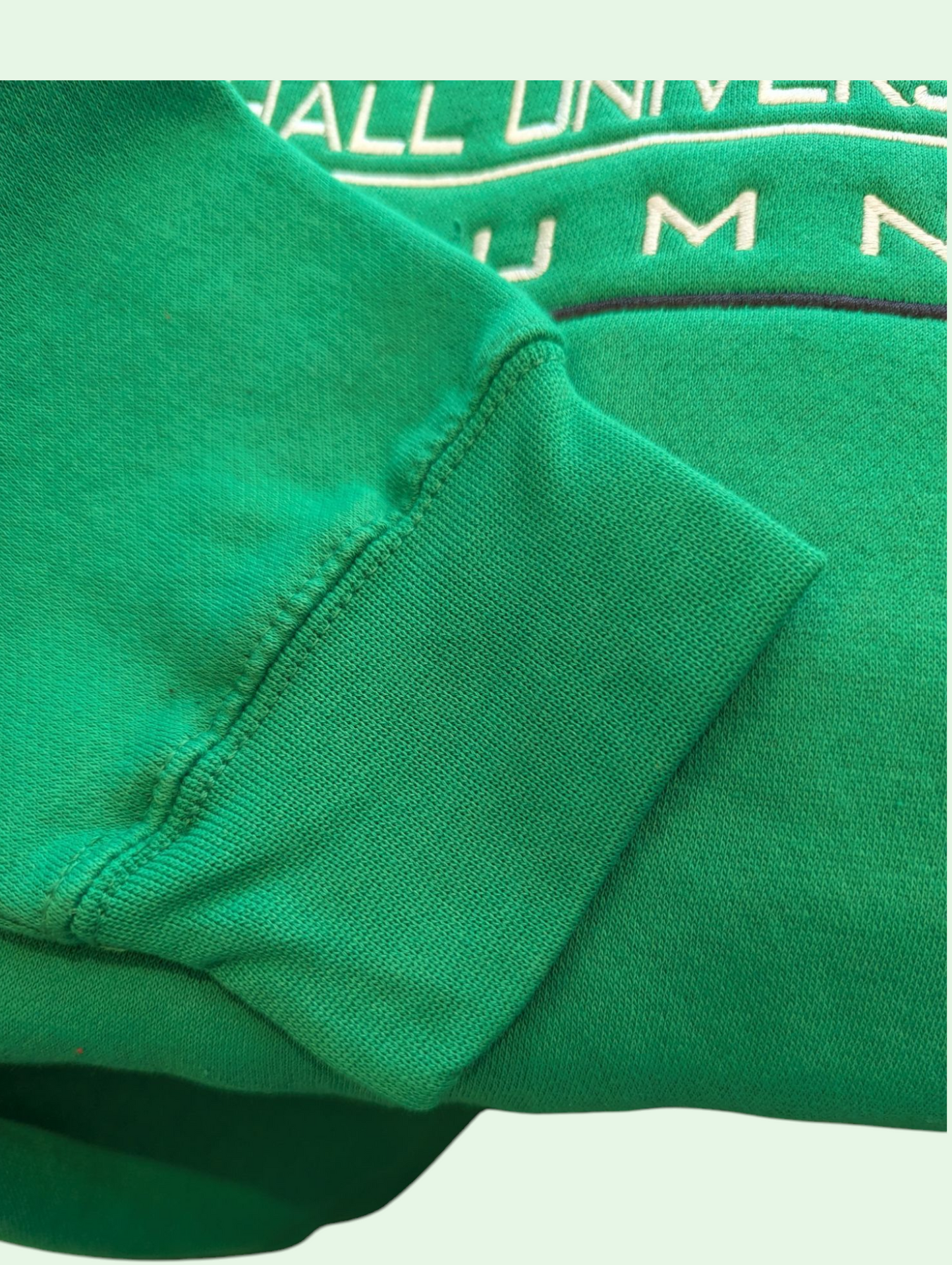 a detail shot of the cuff on the alumni sweatshirt