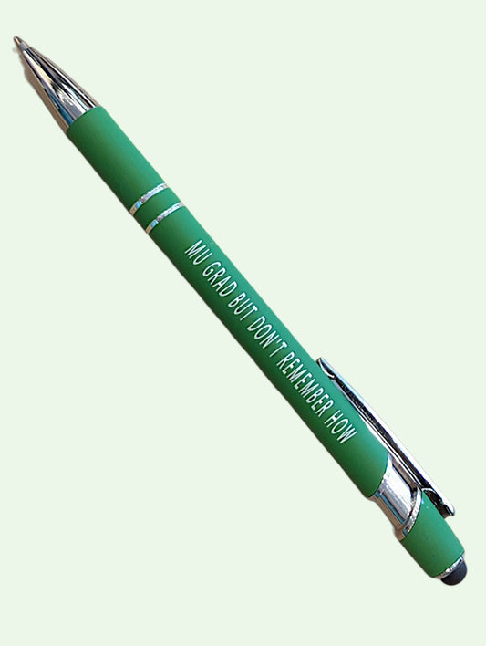 A green retractable pen with silver metal accents and white text that reads 'I'M GRAD BUT DON'T REMEMBER HOW', shown diagonally on a pale mint green background.