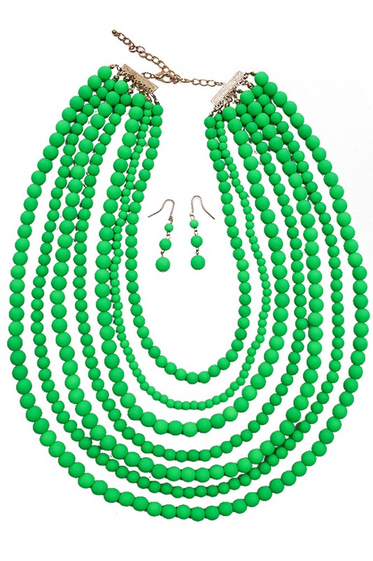 A necklace with 7 strands of neon green beads arranged in a semicirlce