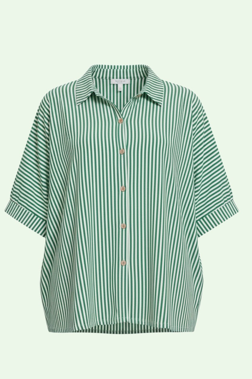 Green and white striped shirt on a light green background