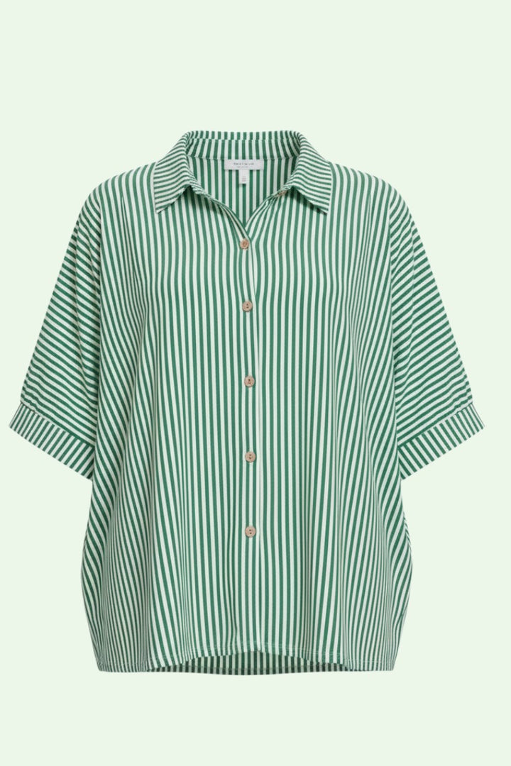 Green and white striped shirt on a light green background