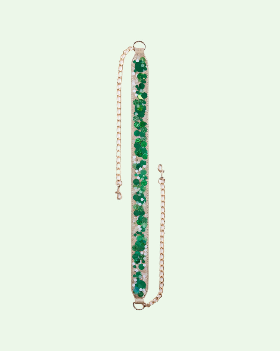 detachable bag strap with gold  chain ends and a strap of clear plastic full of shiny green confetti
