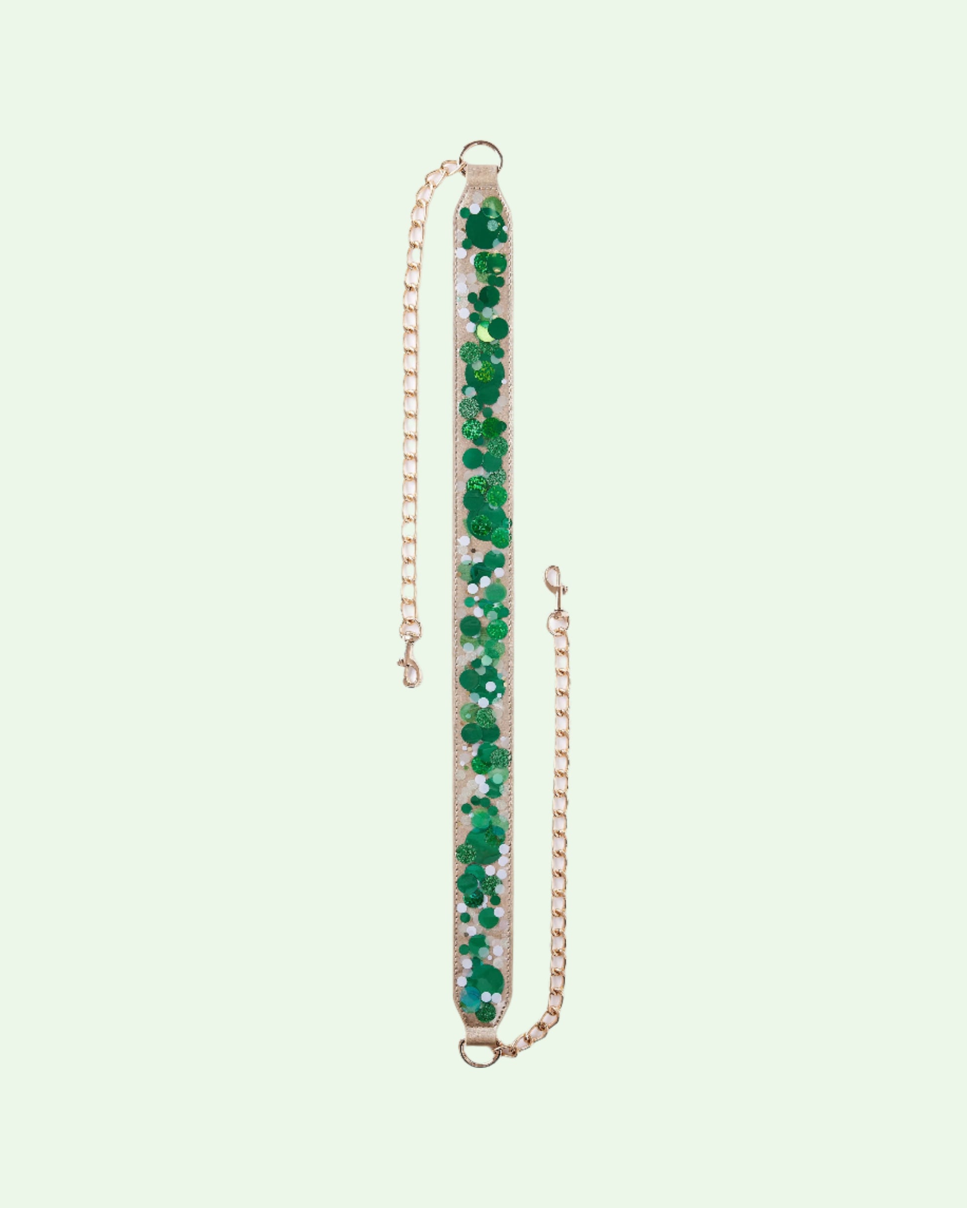 detachable bag strap with gold  chain ends and a strap of clear plastic full of shiny green confetti
