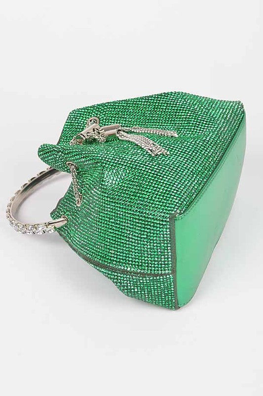 rhinestone bag lying on its side showing the solid green flat bottom