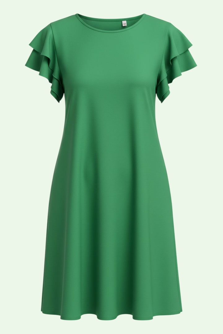 Green dress with ruffled sleeves on a light green background