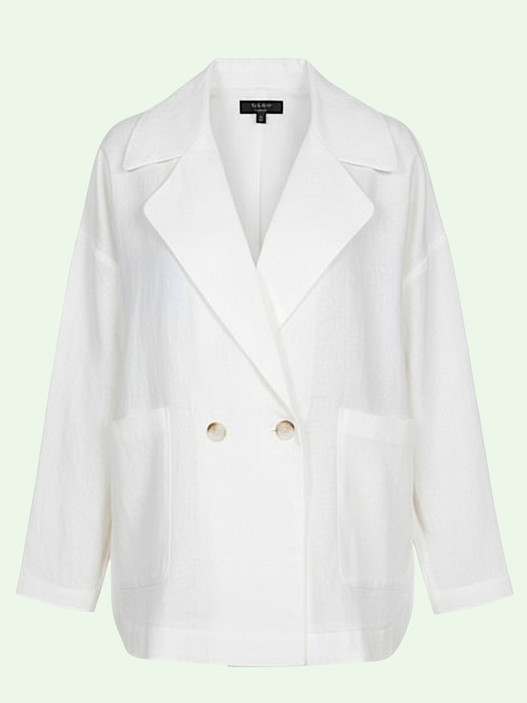 White blazer with brown buttons on a light green background