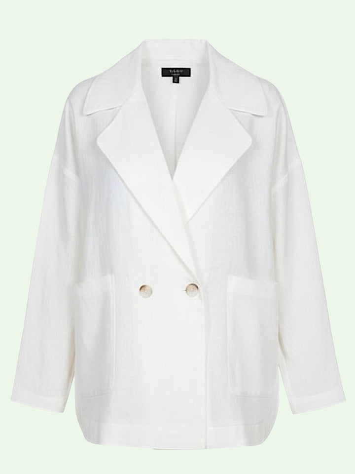 White blazer with brown buttons on a light green background