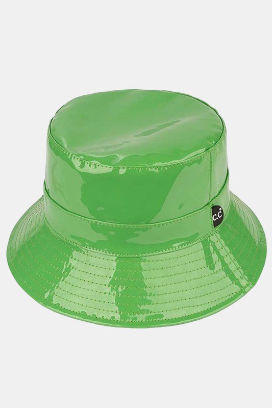 a green vinyl bucket hat with a black CC tag on it