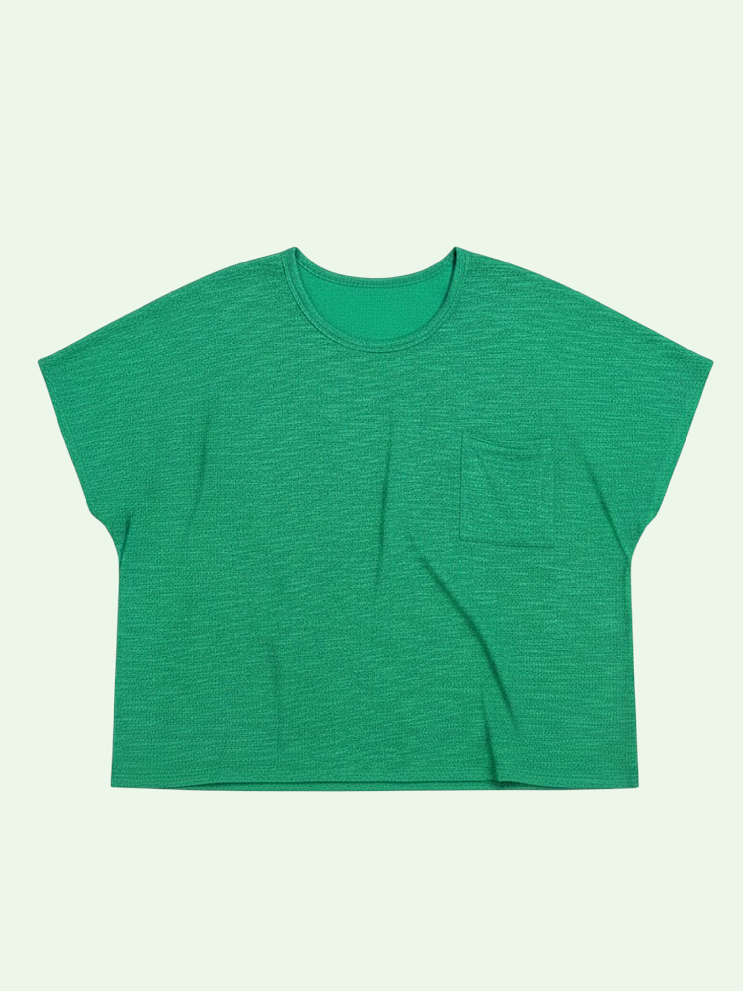 Green t-shirt with a pocket on a light green background