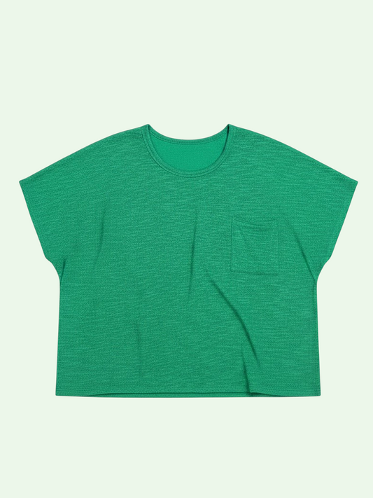 Green t-shirt with a pocket on a light green background
