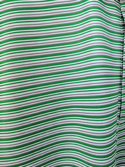 Close-up of a green and white horizontally striped fabric with a gathered side seam.