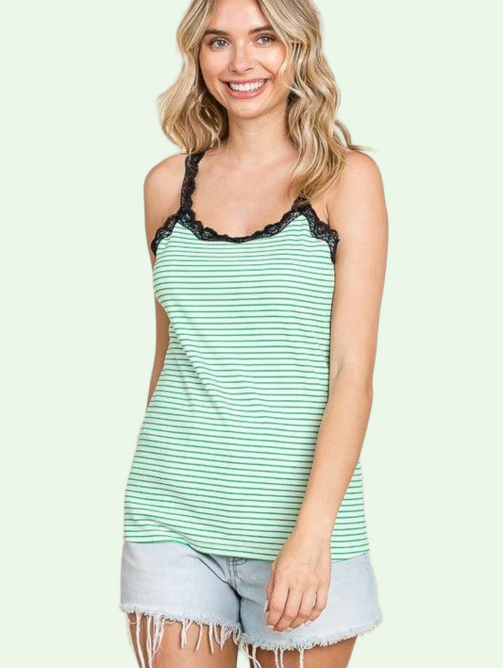 a blonde model shows us the stripe tank top. she has it paired with denim cutoffs