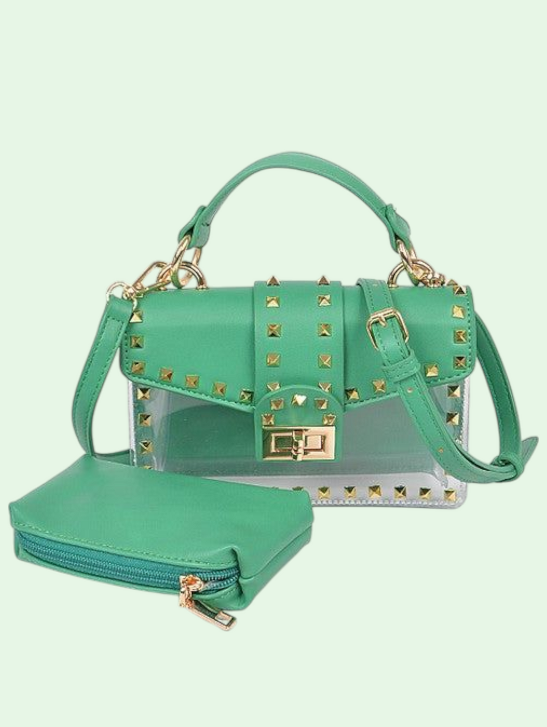 Green handbag with gold studs and matching wallet on a light green background