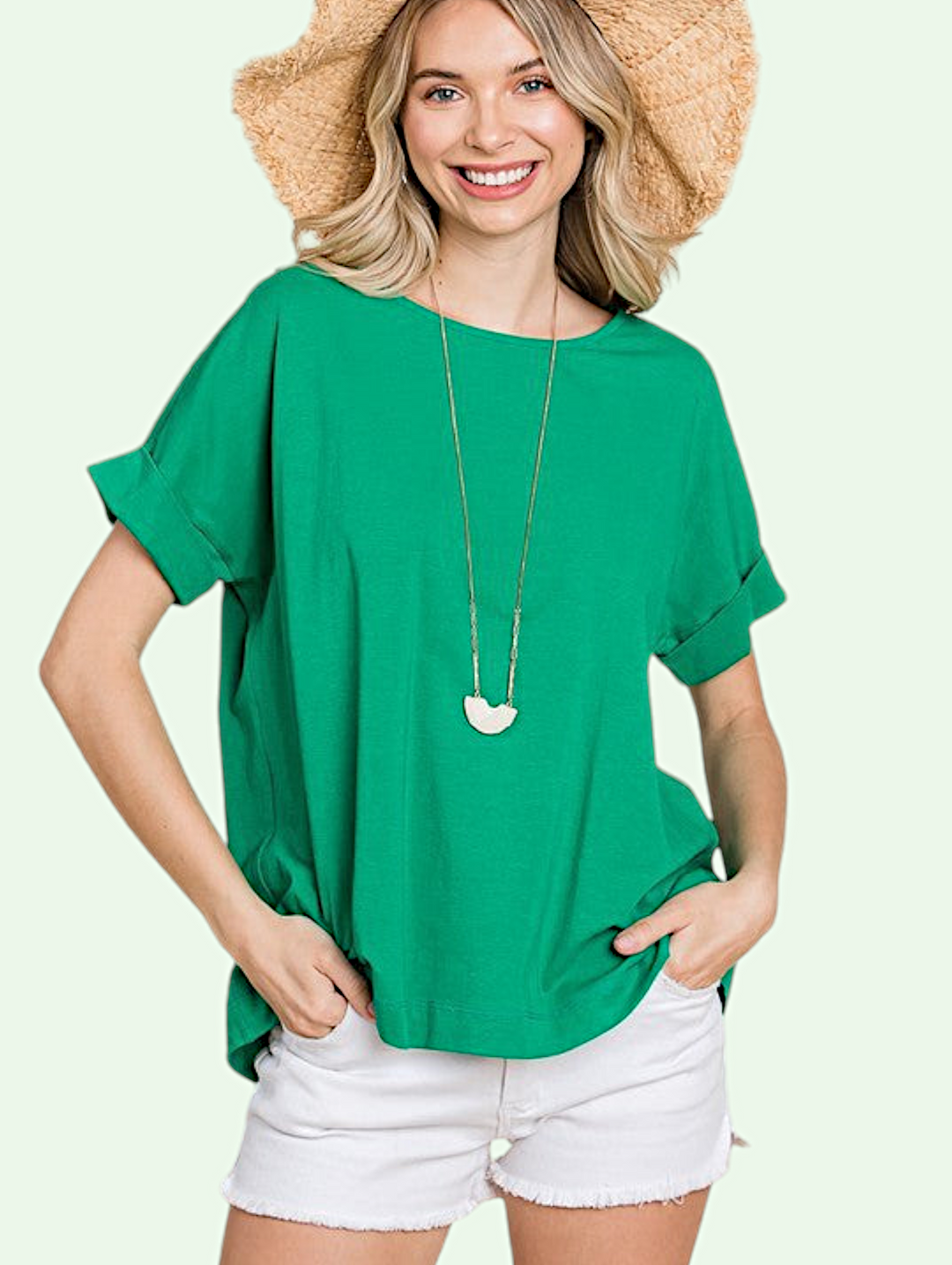 studio shot of a blonde  model in the cuff sleeve top