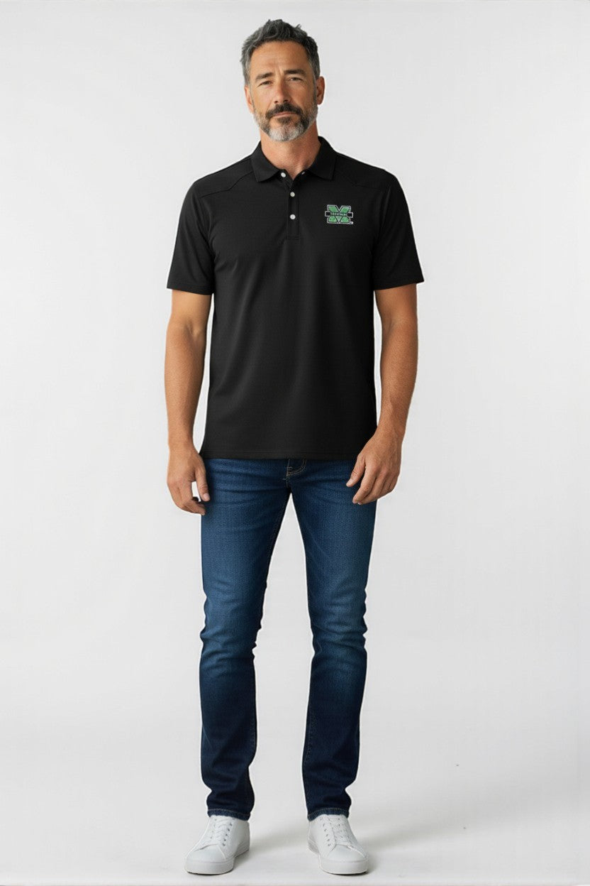 Man wearing a black polo shirt with a logo and blue jeans on a white background
