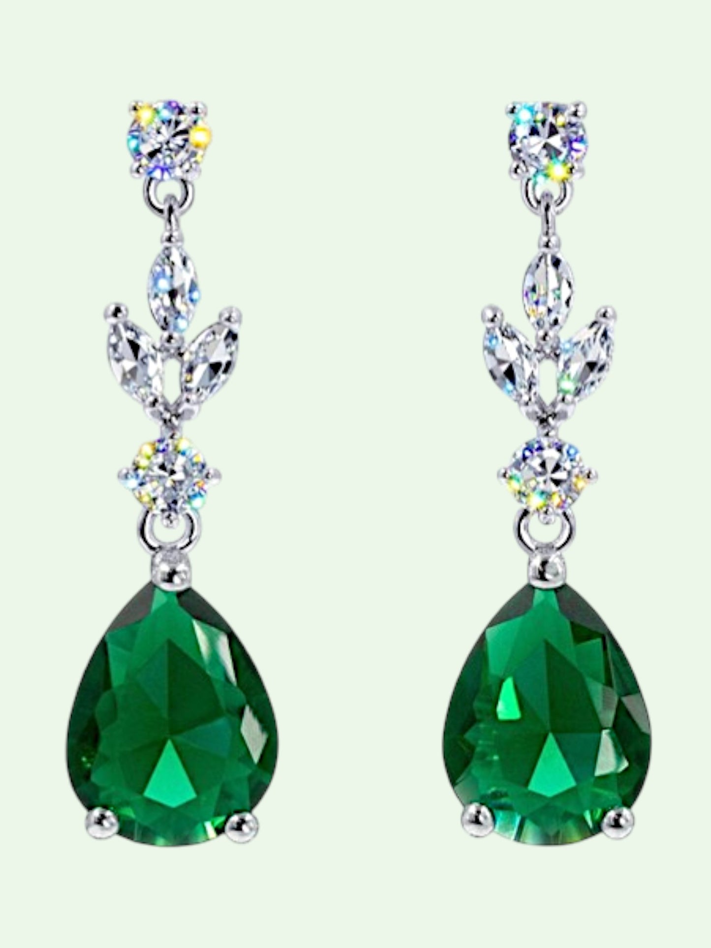 Green teardrop earrings with silver and multicolored gemstones on a white background
