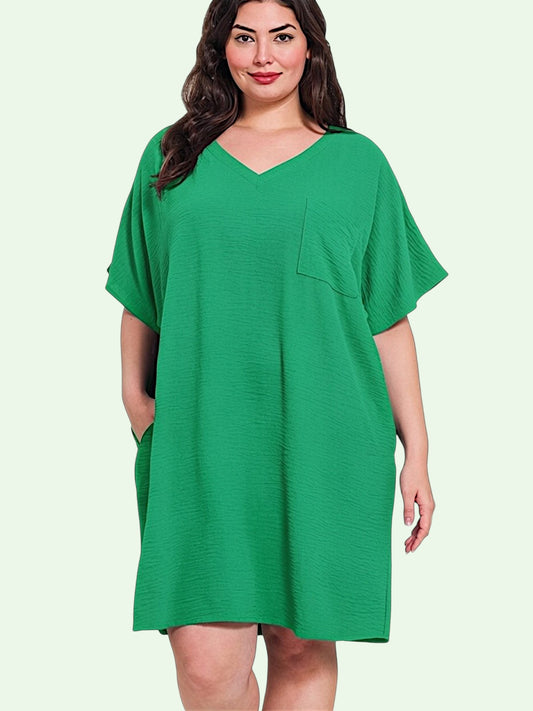 Woman wearing a green dress on a light green background