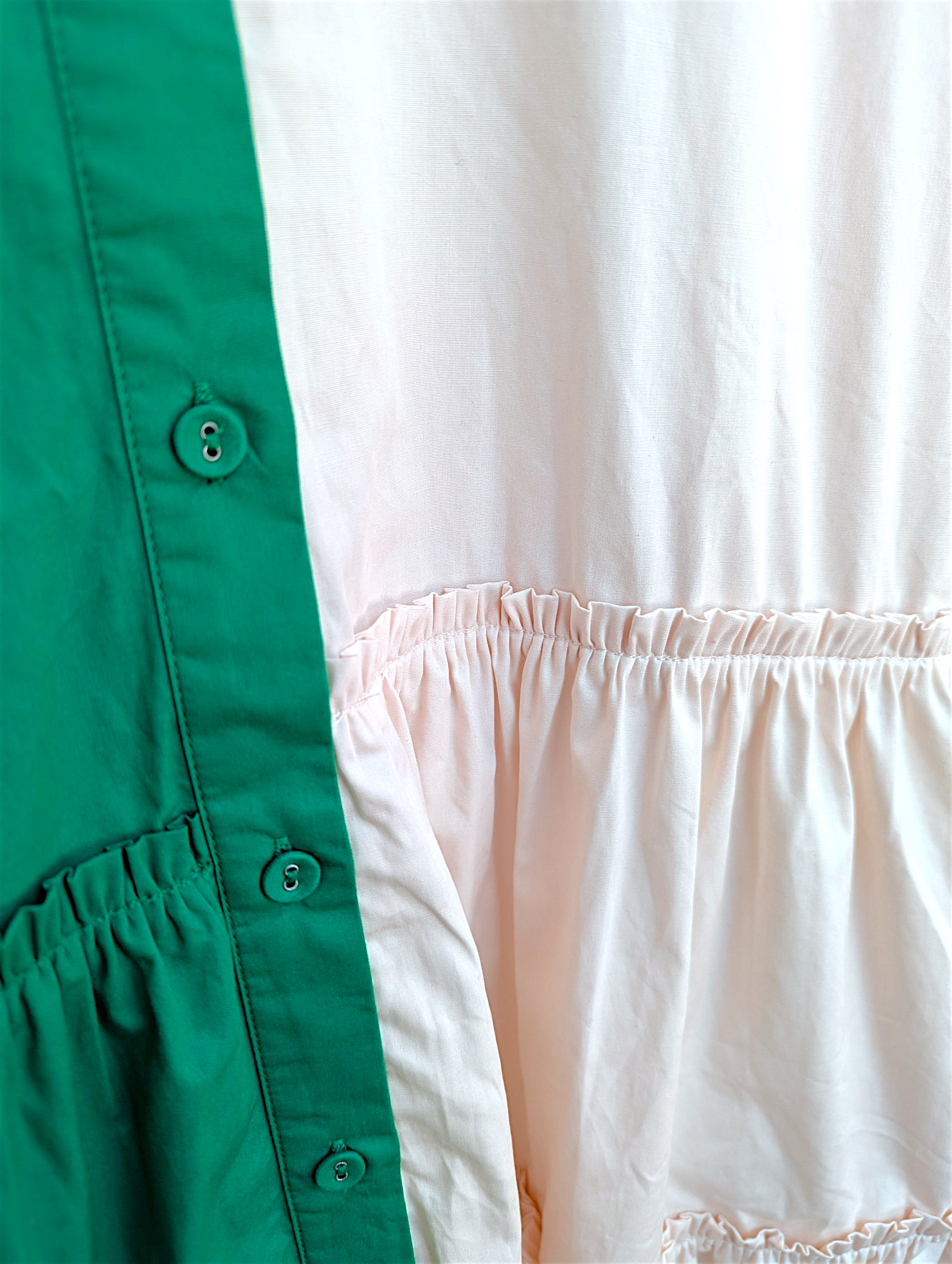 Close-up of a green and white dress