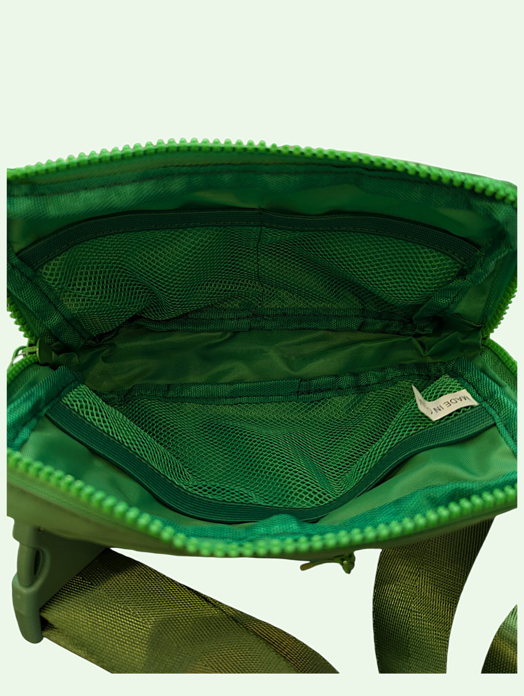 an interior shot of the waist pack showing the mesh pockets