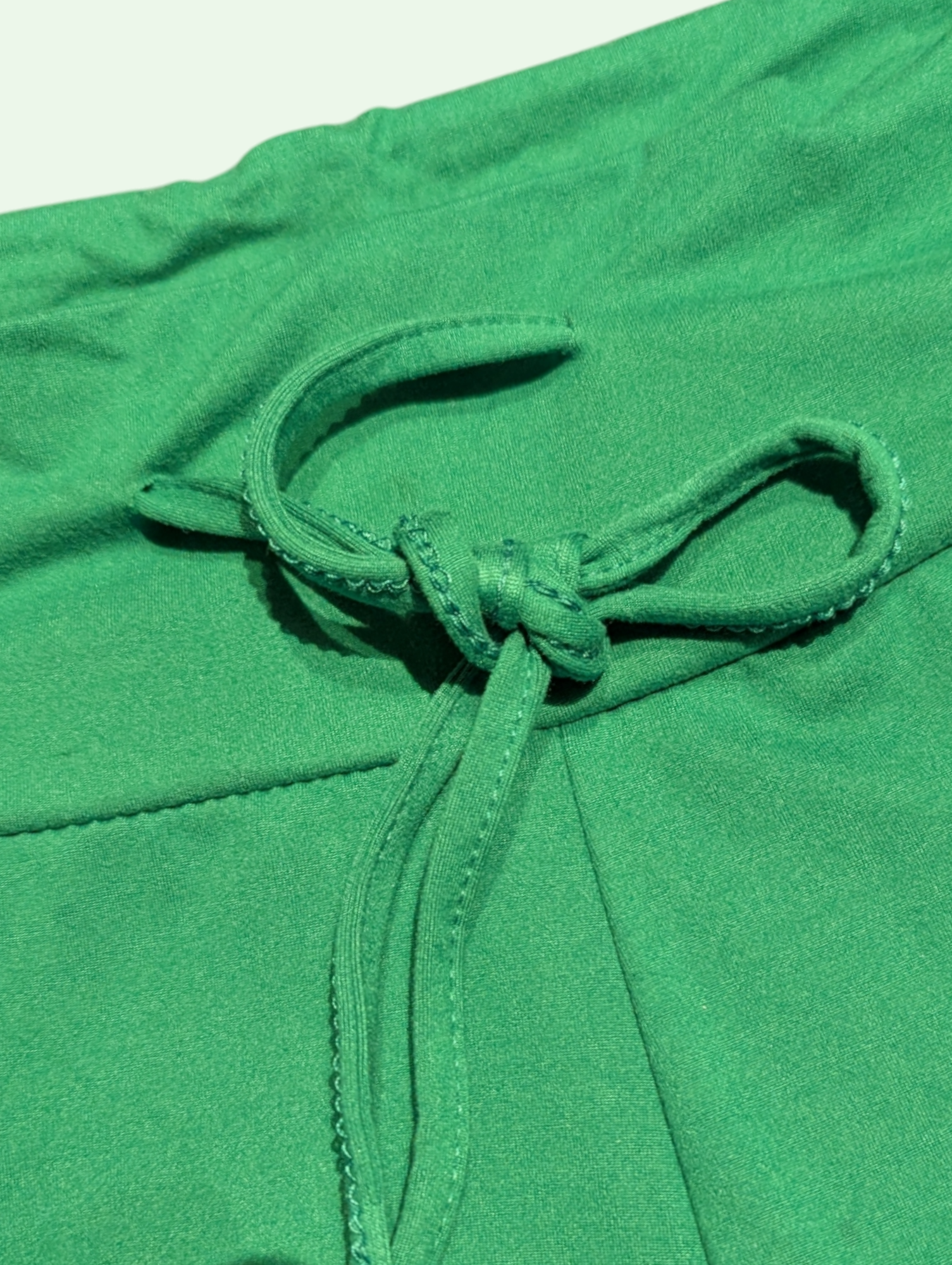 a  detail shot of the tie on the yoga pants