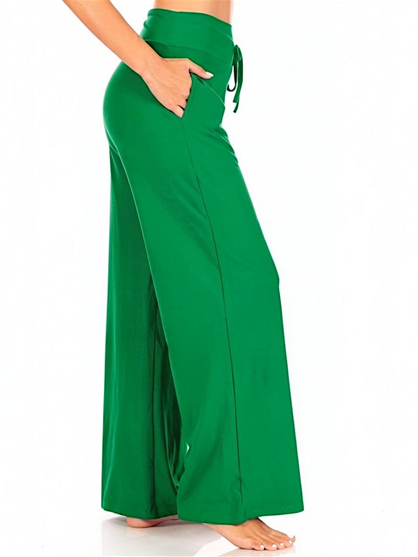 Green wide-leg pants worn by a person on a green background
