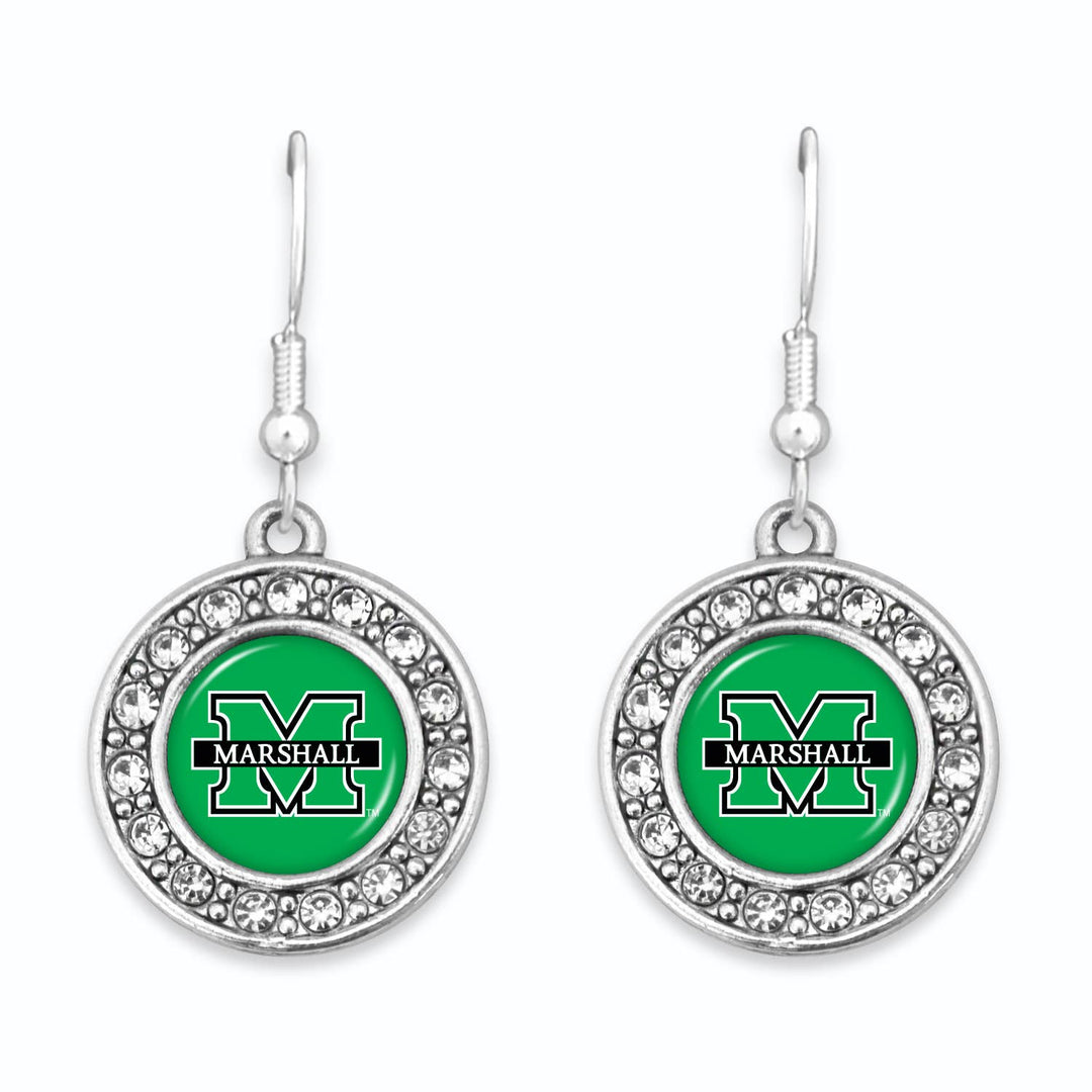 the earrings are  shown close up and are a round silver charm with a green center with a marshall block m logo inthemiddle surrounded by a row of clear rhinestones